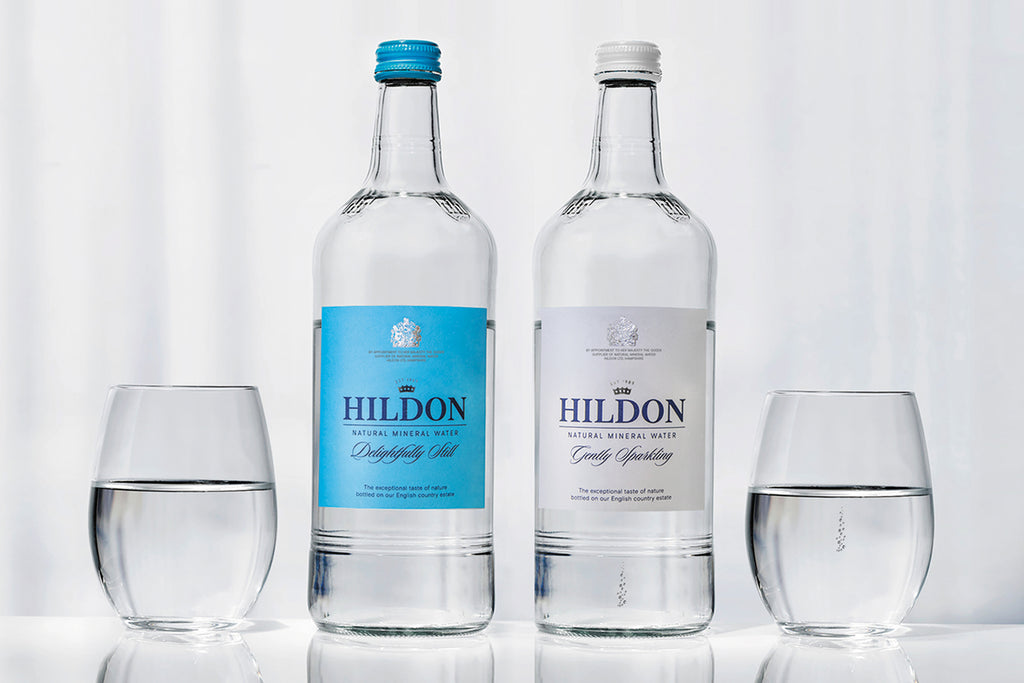 2 x HIldon Bottled Mineral Water, Still and sparkling, with 2 glasses of water